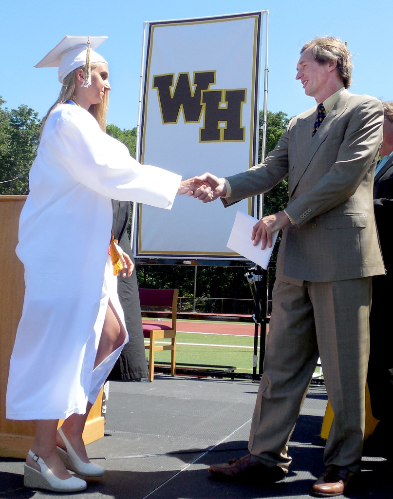 (above l-r) Watchung Hills Regional High School Vice President Dr. Gregory Przybylski of Warren Township congratulates his daughter, Claudia, as he presents her with her diploma at the graduation at Watchung Hills Regional High School, Wednesday, June 24.