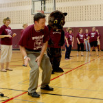 Woodland Principal Jeff Heaney leads students in calisthenics.