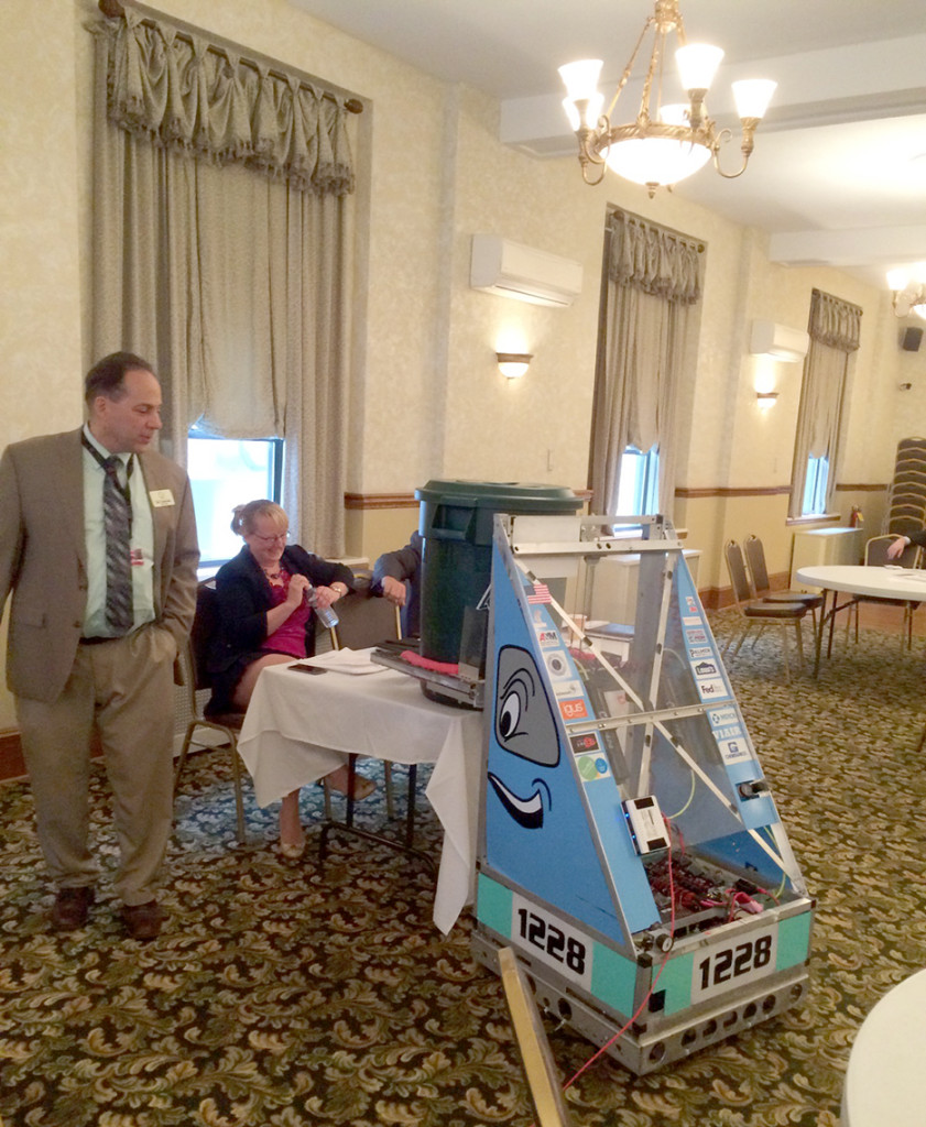 (above) Rahway High School Technology teacher Greg Wesolowich and some of his students presented their robot during the November Chamber of Commerce Meeting. Robo Tribe is an FRC robotics team. Every year, beginning from Kickoff, the students design and build a robot within the allotted time of six weeks. They them up against dozens of other student built robots all across the nation in the annual FIRST Robotics Competition (FRC). The award-winning team is in their 12th year of participating in FRC.