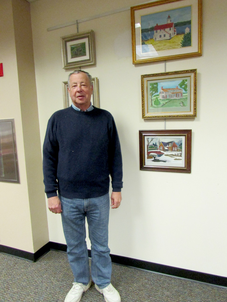 (above) David Greene stands with his painting of the Coddington House (on the right) at SCLSNJ’s Warren Library branch’s art space.