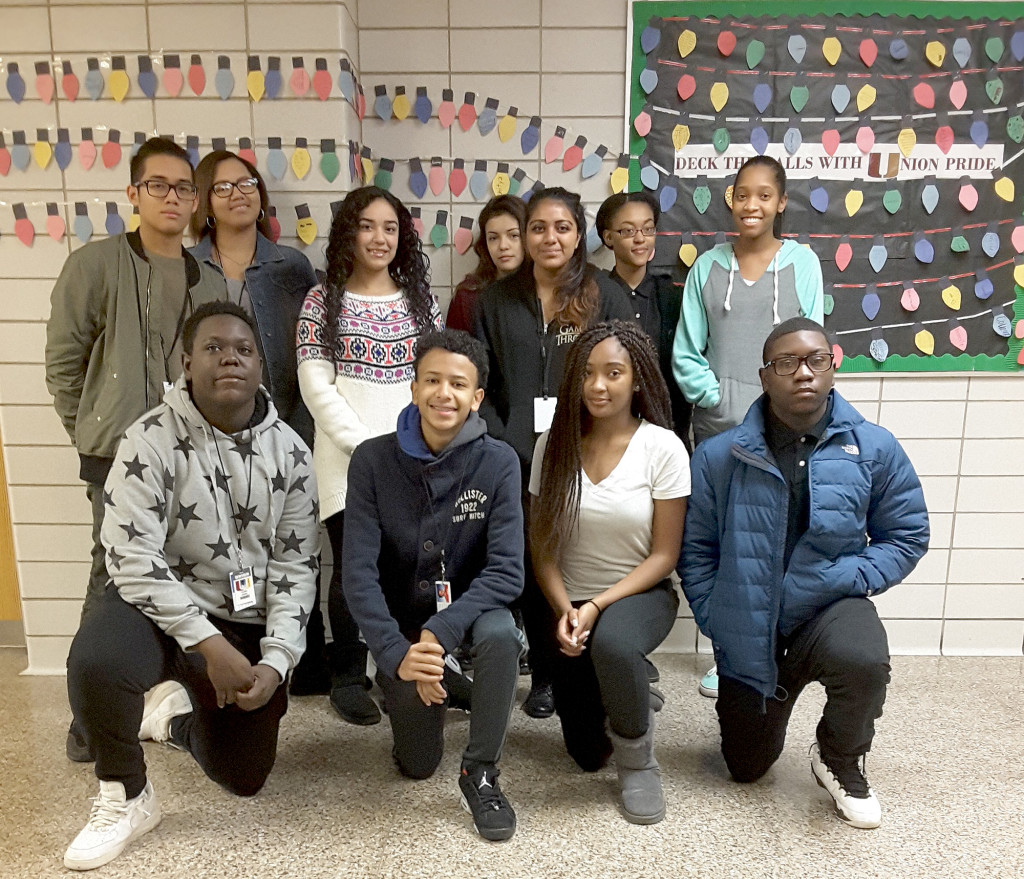 (above) Students discuss a special holiday project worked on by the Junior class of Union High School. Top Row left to right- Jason Romano, Kya Smith, Summer Chaudry , Nicole Losada, Ashali Kumar, Theresa Nnoli, Briana Young Bottom left to right- Jordan James, Ishmeil Scott, Dasia White, Isaiah Vaughn