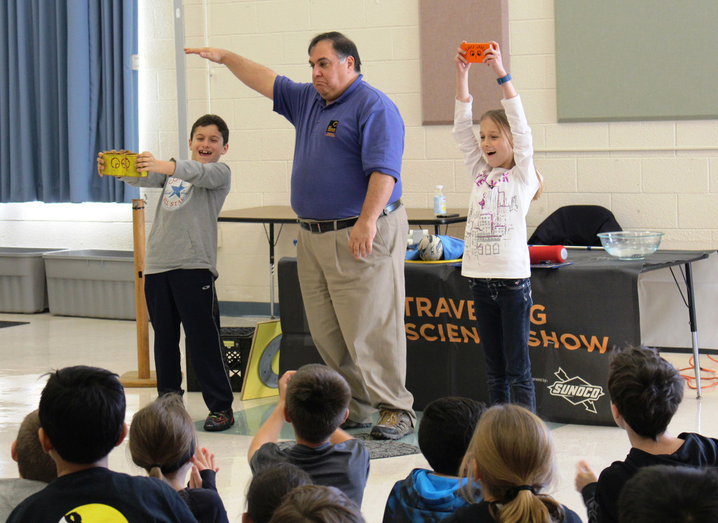(above) ALT 4th graders Dylan Sempervive and Victoria Dziasek demonstrate a scientific formula with the help of Joe Talento.