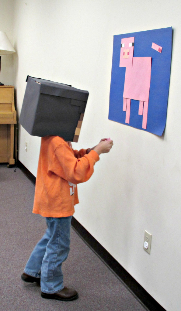 (above) Jacob Coslit, age 7, of North Plainfield plays "Pin the Tail on the Minecraft Pig" at the Minecraft Party on November 14, 2015.