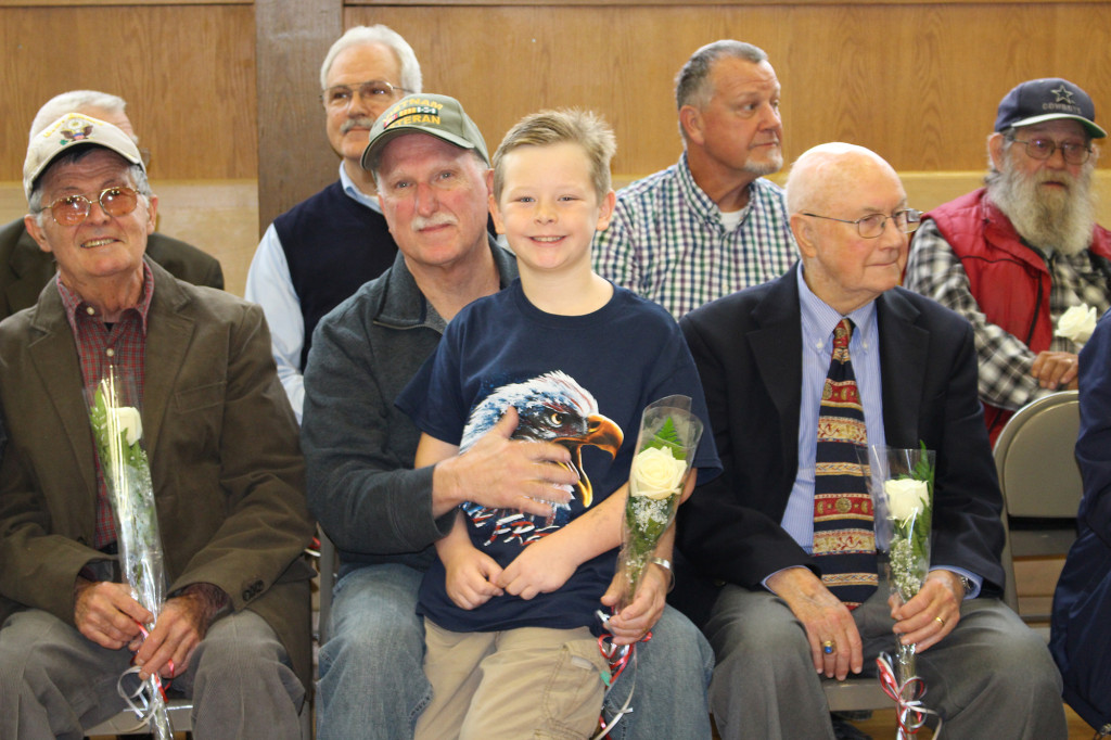 (above) Brookside Place School celebrated Veterans Day by honoring 17 local veterans who were the parents and grandparents of BPS students. Here, BPS fourth grade student, CJ McCarthy of Cranford joins his grandfather, John, and fellow vets Fred Reingold (left) and George Towne (right) at the annual ceremony.