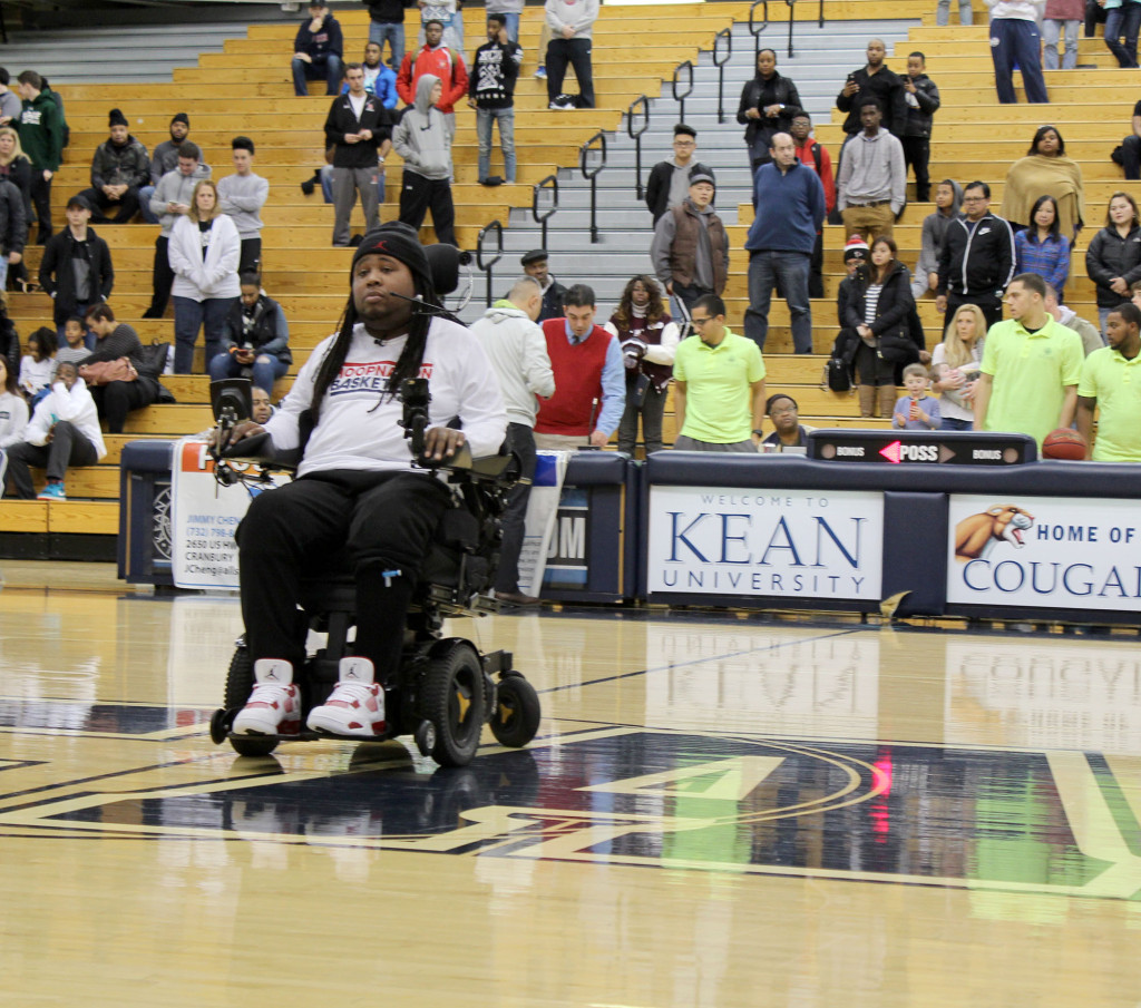 (above) LeGrand addressing the audience during half time of the Roselle Catholic vs. St. Gil Bernard's Game.