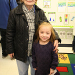 Happy kindergartner with grandparent