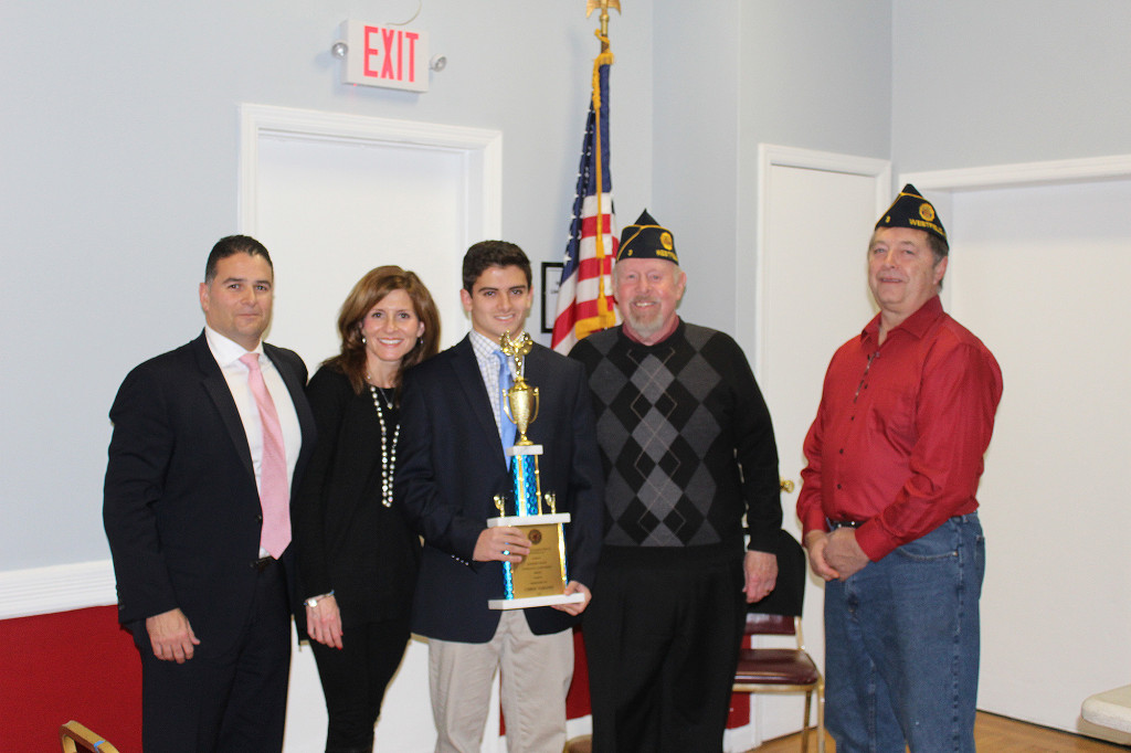 (above) Commander Allan Betau and Post Adjutant Jack Ford shown with the recipient of the Ray Bailey Award, Chris Verano and his parents Mike and Michelle Verano.