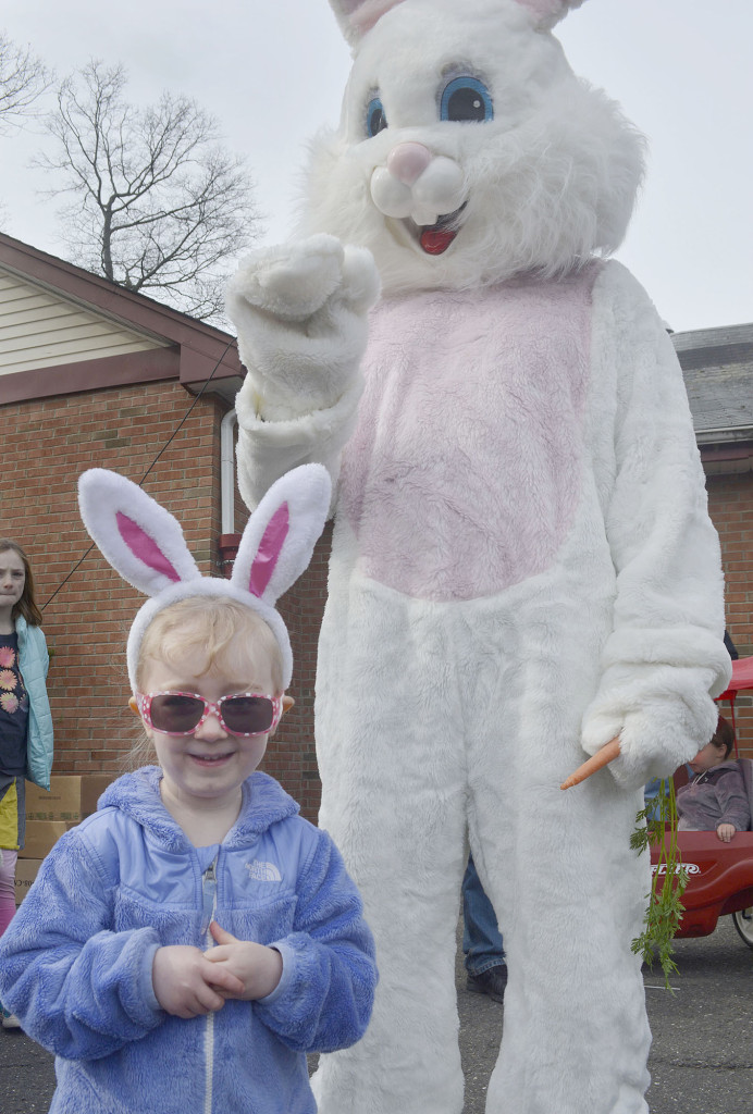 (above) Sporting her own set of bunny ears, three-year-old Colette Maynard of Fanwood poses for a photo with the Easter Bunny.