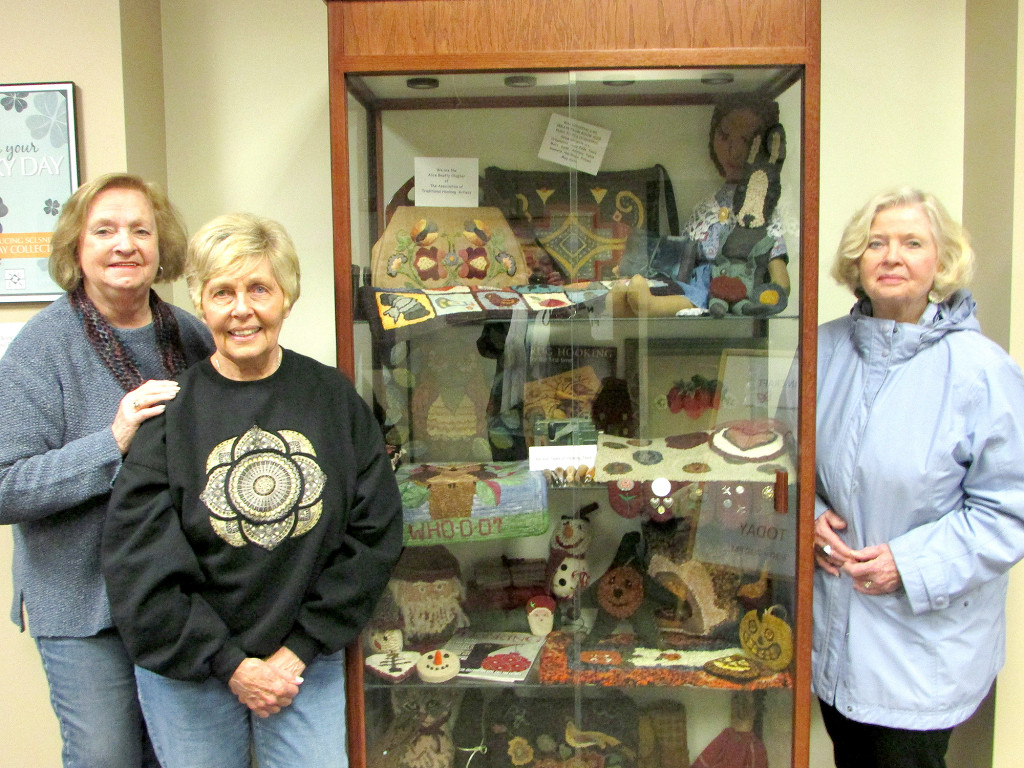(above) The Alice Beatty Chapter of The Association of Traditional Hooking Artists members (left to right): Arline W.Bechtoldt- Apgar, Susan Johnson, and Phyllis Fittipaldi.