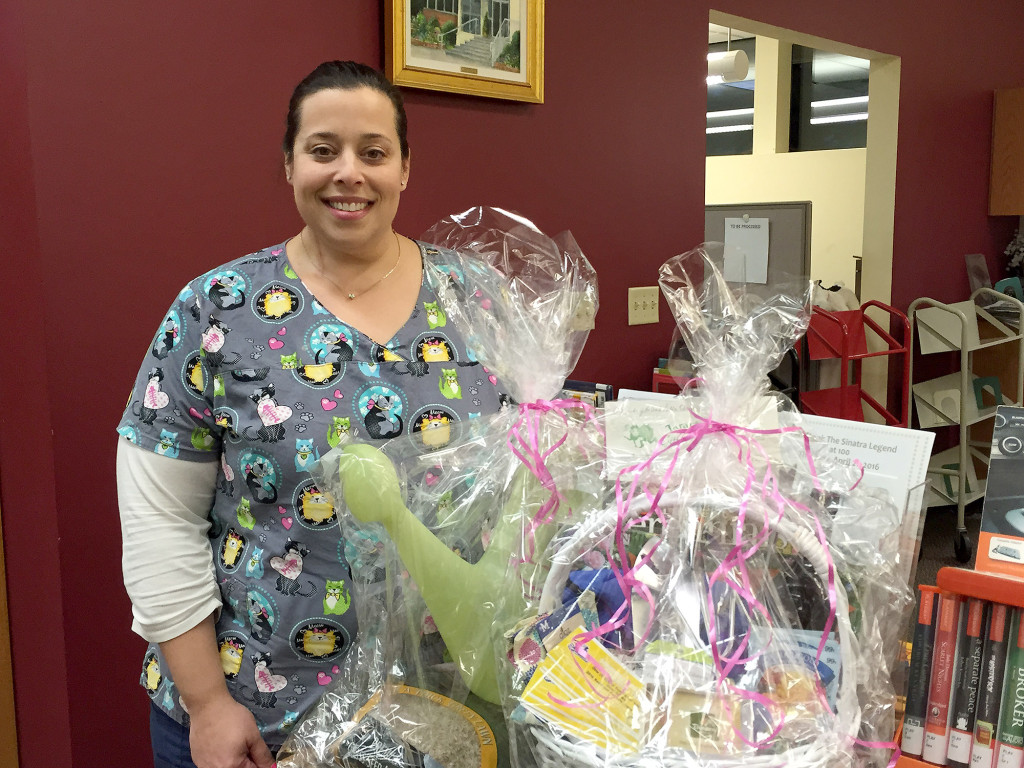 (above) Carla Tridente was the winner of the April Friends of the Clark Library raffle basket. The Friends would like to thank everyone who participated for supporting the Friends of the Clark Library. A special thank you to Bartell's Garden Supply, Tarantellas's Restaurant and Ace Hardware, all in Clark, for their generous donations.