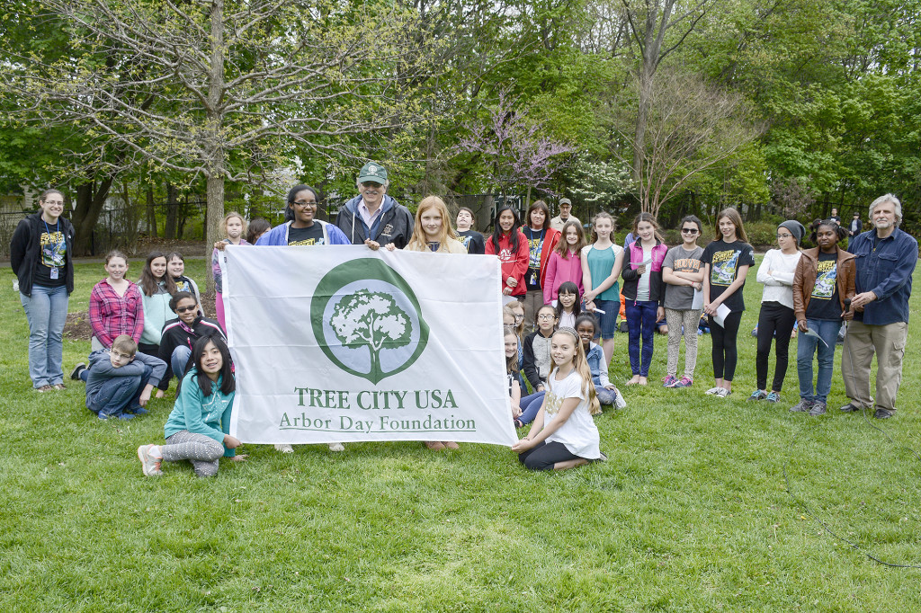 (above) Environmental Club holds up Tree City USA banner, earned for the 23rd consecutive year by the Borough.