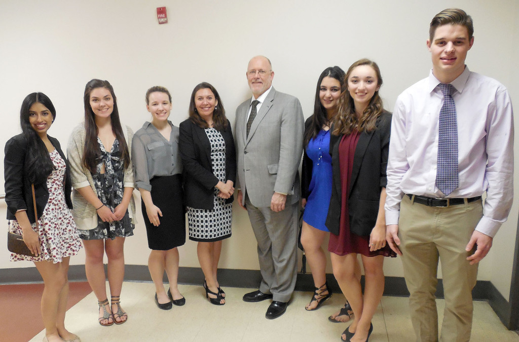 (above) Standing on either  side of guest speaker Amanda Seewald, fourth left, president of the Foreign Language Educators of New Jersey, and Brad Commerford, supervisor of World Languages at WHRHS, are students (l-r) Senior Anjali J. Patel of Warren Township; senior Olena Alexandra Hadlet of Millington; junior Arielle Ostry of Green Brook Township; junior Sonali Howe of Green Brook Township; senior Jenna Charko of Warren; and senior Lukas Ihringer of Gillette. Sonali Howe, was inducted into two language honor societies, Latin and Spanish.