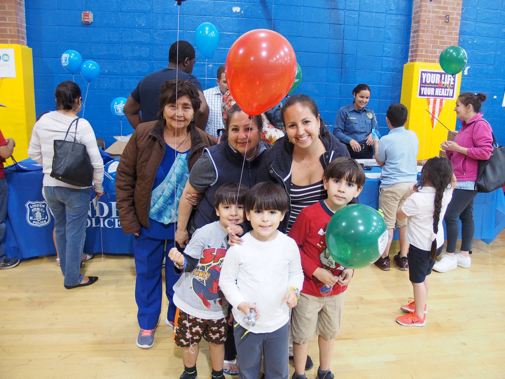 (above) Matteo Pinto and his family enjoy learning as a family at the School No. 1 Health and Wellness Fair.