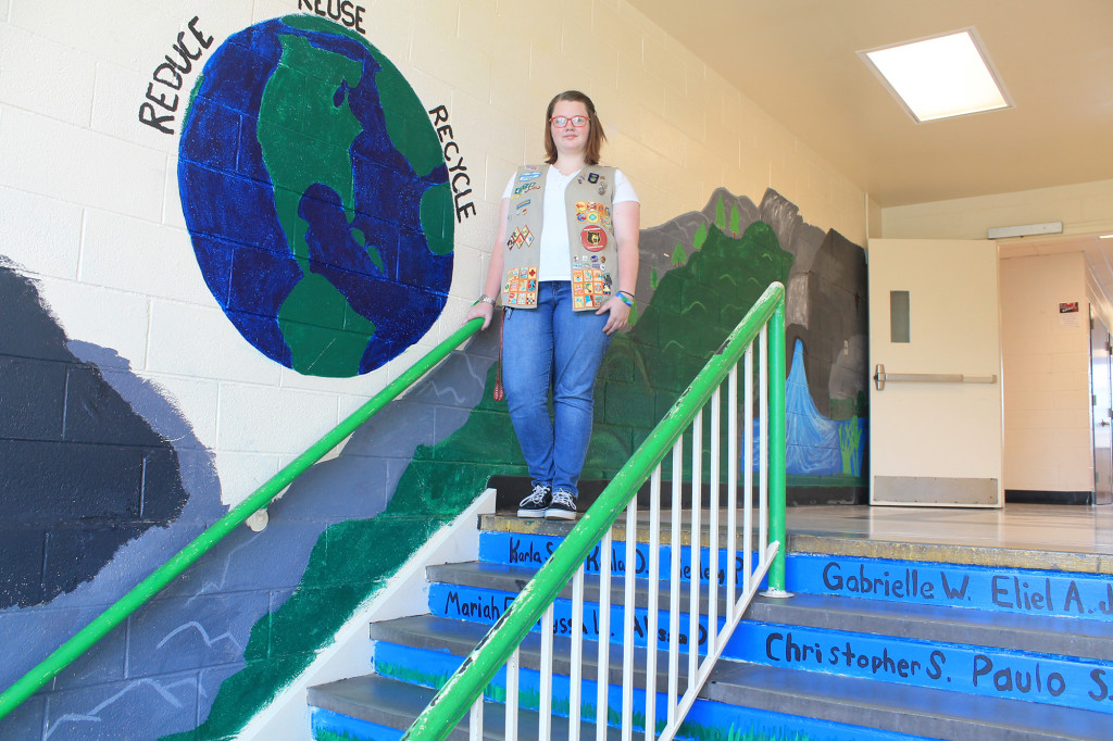 (above) Rose Northcott poses in front of her project, "Reduce, Reuse, Recycle"