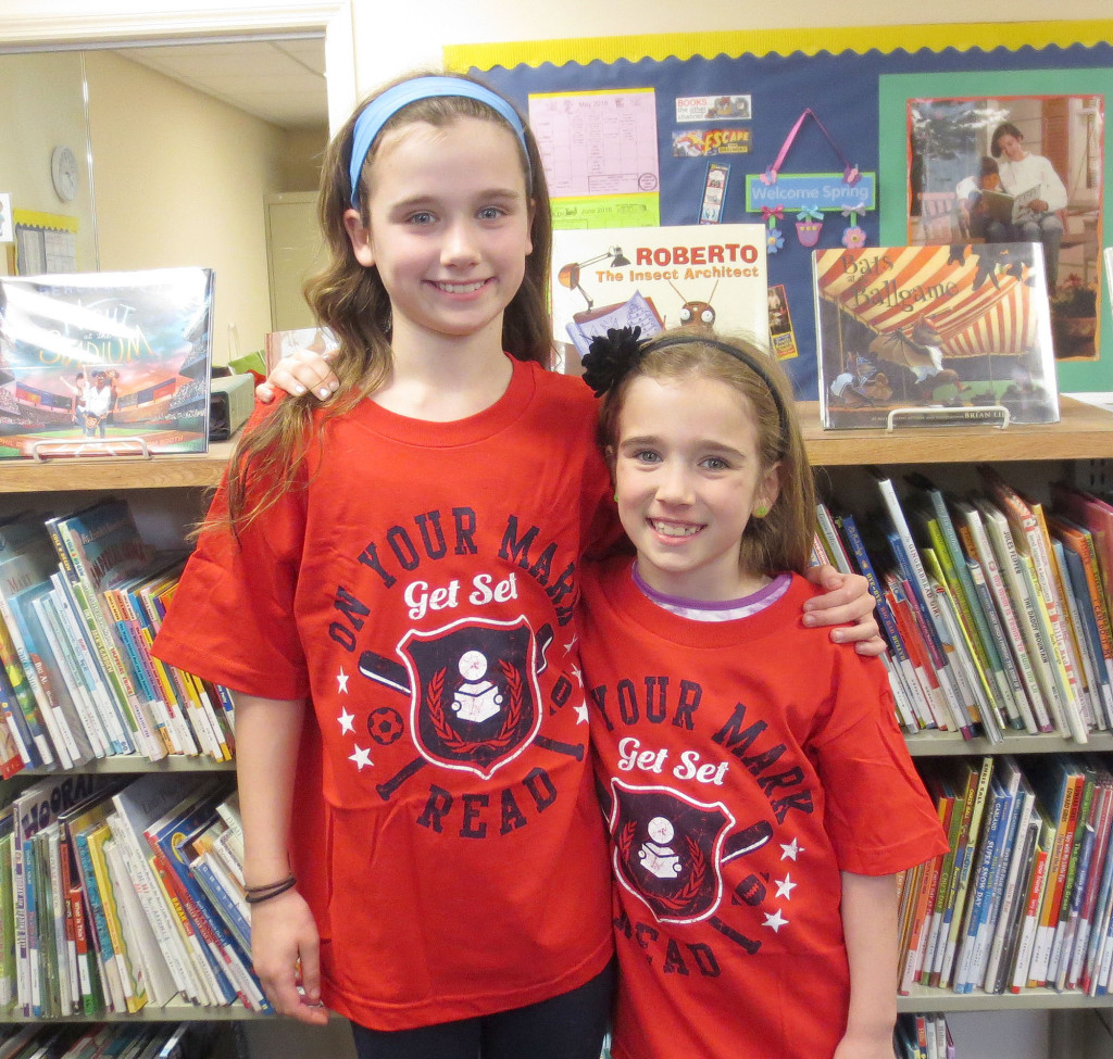 (above) The Kenilworth Public Library will have a limited number of “On Your Mark, Get Set, Read!” 2016 summer reading tee shirts available for sale in both children's and adult sizes, at $6.00 per shirt, beginning June 13. Modeling the shirt in various sizes are Maeve and Lily Kessler of Kenilworth. For more information or to purchase a t-shirt.
