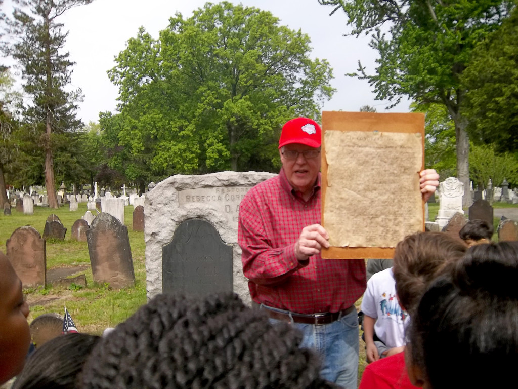 (above) Historian Al Shipley displayed a copy of the Declaration of Independence to the students before showing them the gravesite of Abraham Clark in Rahway Cemetery.