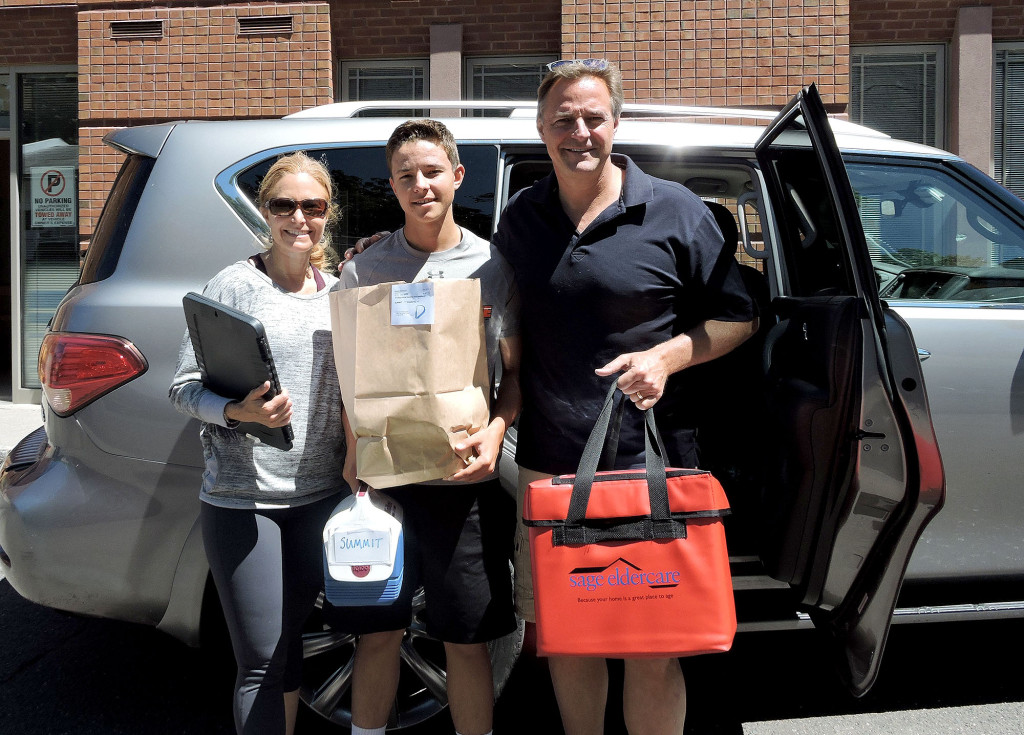 (above l-r) Lori, Jack and Al Leiter getting ready to deliver meals.