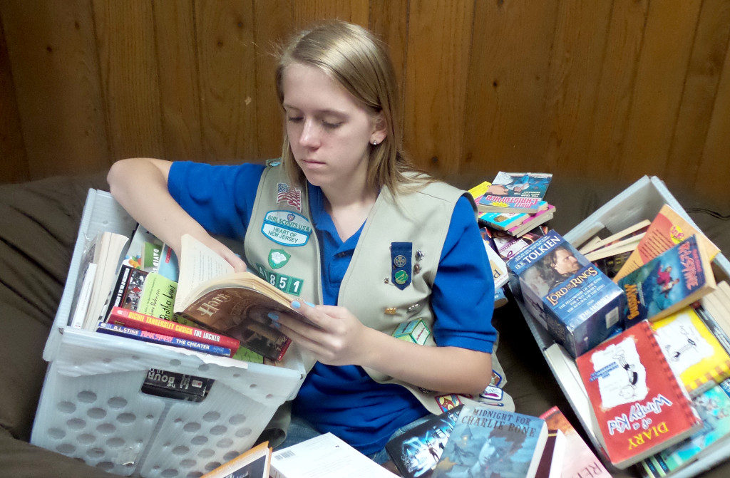 Girl Scout collecting books Mountainside