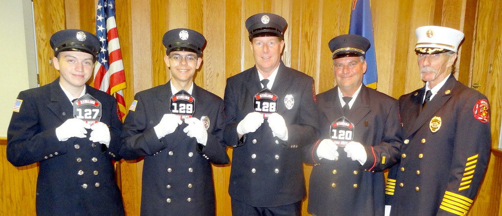 (above l-r) The Township’s newest firefighters proudly display their new helmet shields after completing several weeks of firefighter training: Alex Honegger #127, Chris Hoffman #129, Joe Giere #128, and George Alto #120.