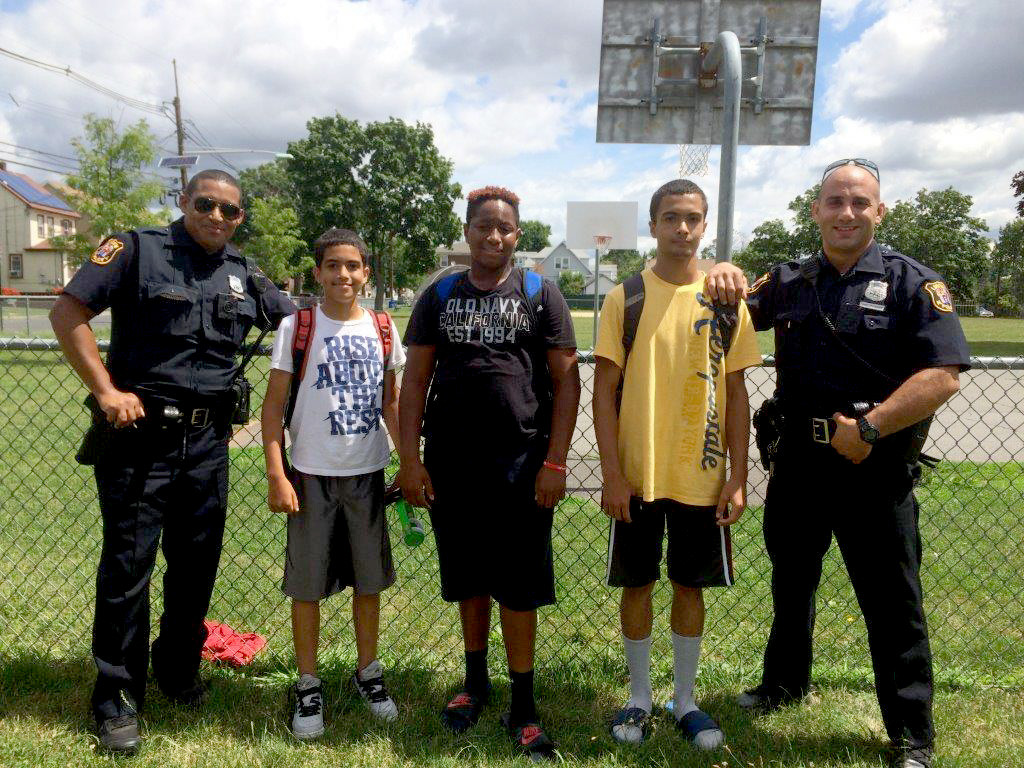 (above) One day over the summer, two Linden Police officers took some time out of their patrol shift to talk to some local teenagers and shoot some "hoops" with them at 5th Ward Park on Dill Avenue.