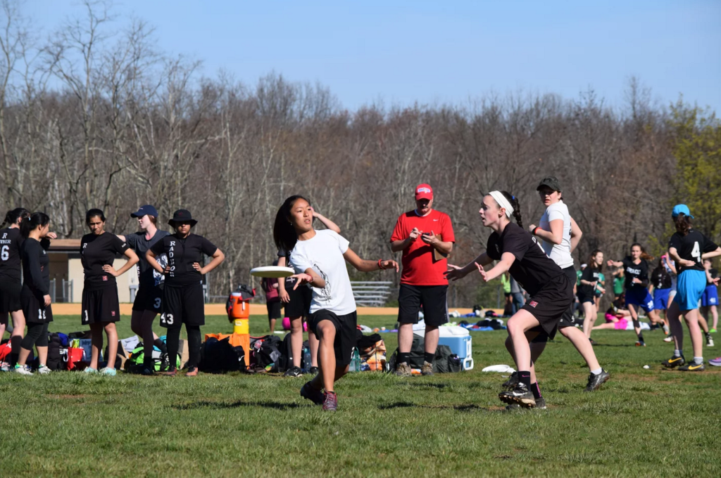 (above) Jessie Sun attempting to throw the Frisbee against fellow opponents