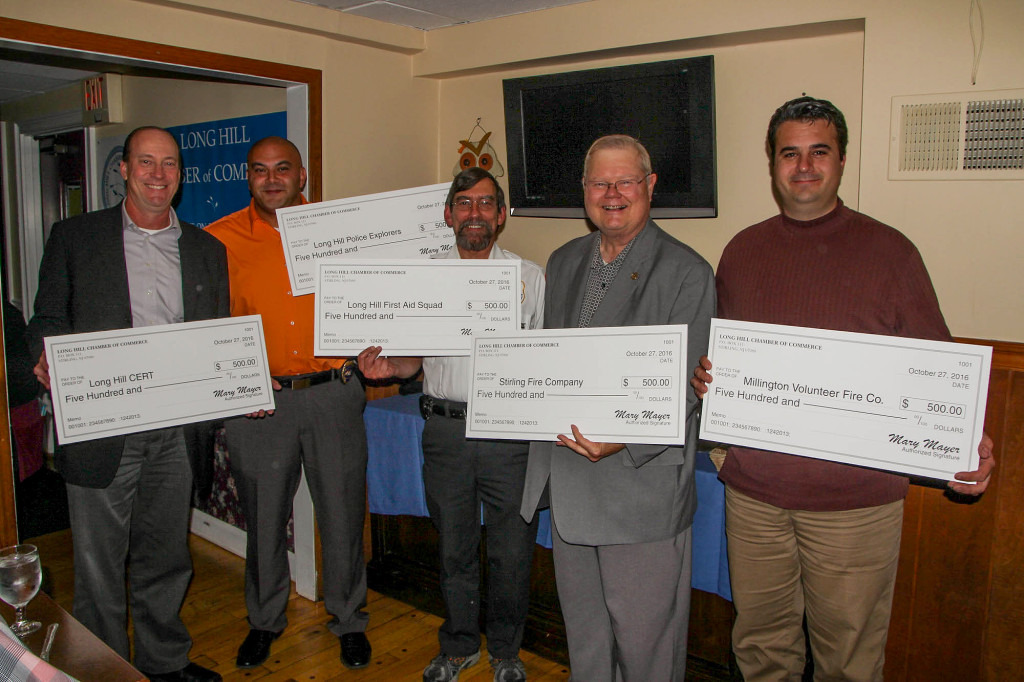 Civil Service officers receive $500 donations from the Long Hill Chamber of Commerce. (above) CERT, Jay Wigena; Police Explorers, Lt. Ahmed Naga; First Aid Squad, Jim Dellafichio; Stirling Fire Co., Frank Reilly; Millington Volunteer Fire Co., Chief Charles Horvath.