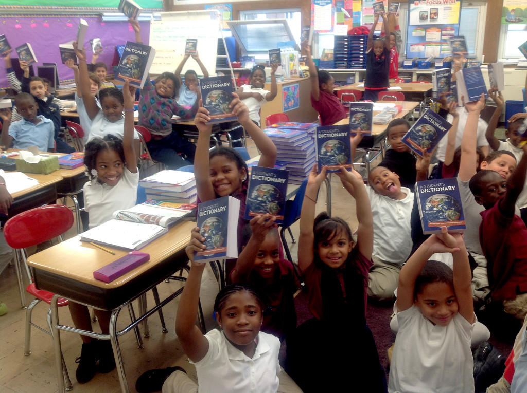 (above) Happy children proudly display their new dictionaries, a gift from the Rotary Club of Plainfield-North Plainfield, during a recent presentation.