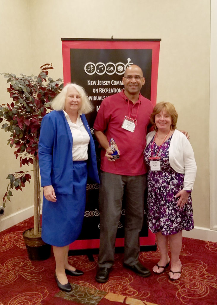 (above) (Middle) Kevin Taylor receives award from NJ CRID Board Members (l-r) Michelle Collins and Pat Swartz at the annual NJ CRID Conference.