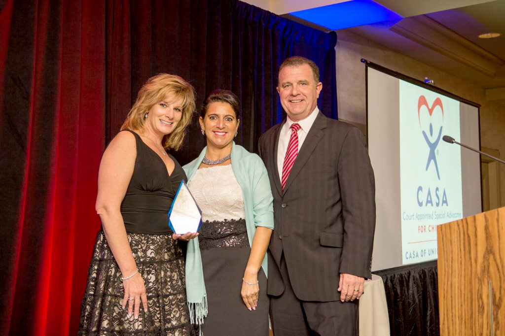 (above) From left, Michele Chapman; Jen Mutch, president of CASA’s board of trustees; and Doug Chapman.