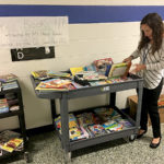 Kindergarten Teacher Miss Maag shopping for books at Mt Horeb School