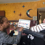 RUT 5 Sonya works with writer Charlie Fieramosca using touch screen images to select words