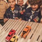 boy_scouts_building_cars