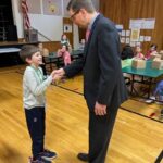 Career Day George Goncalves practicing handshake