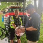 FPPD-Community-Officer-Faith-Carney-pulls-winning-Rotary-Raffle-Tickets-7.4.2023